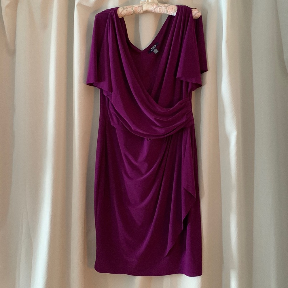 A beautiful knee length purple faux wrap dress.